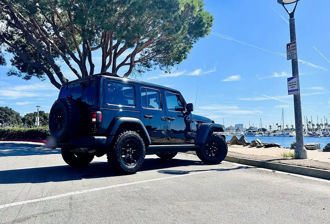 Flota-managed black Jeep Wrangler Willys at the San Diego marina